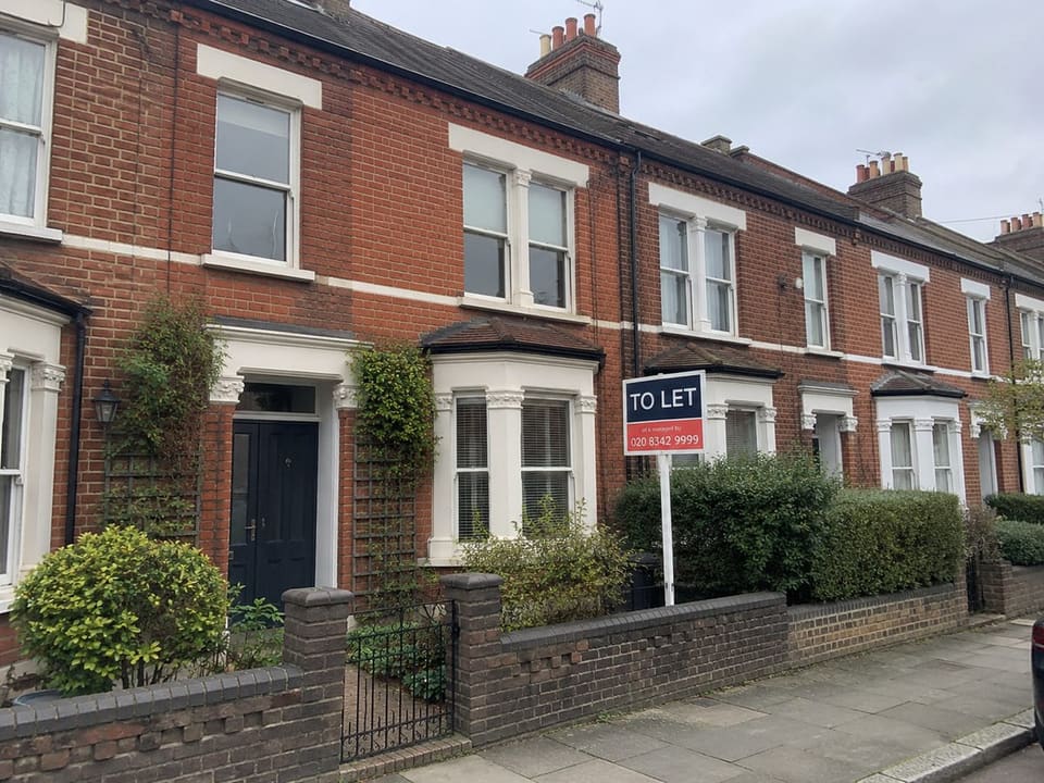 A British terraced house with a To Let board